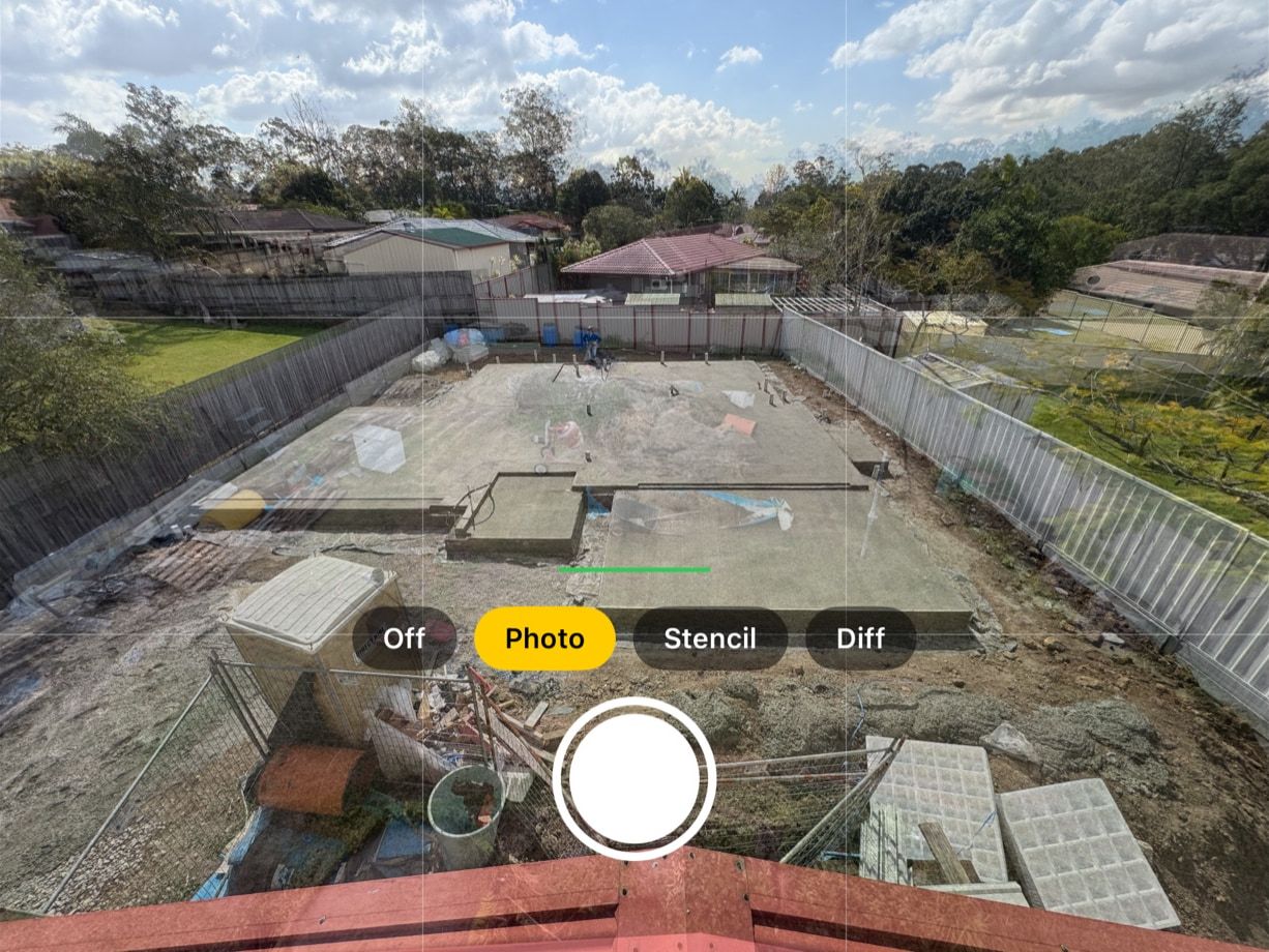 iPhone camera view: the 16 Aug backyard shows faintly over a concrete slab, with the Off, Photo, Stencil and Diff buttons and the shutter below.