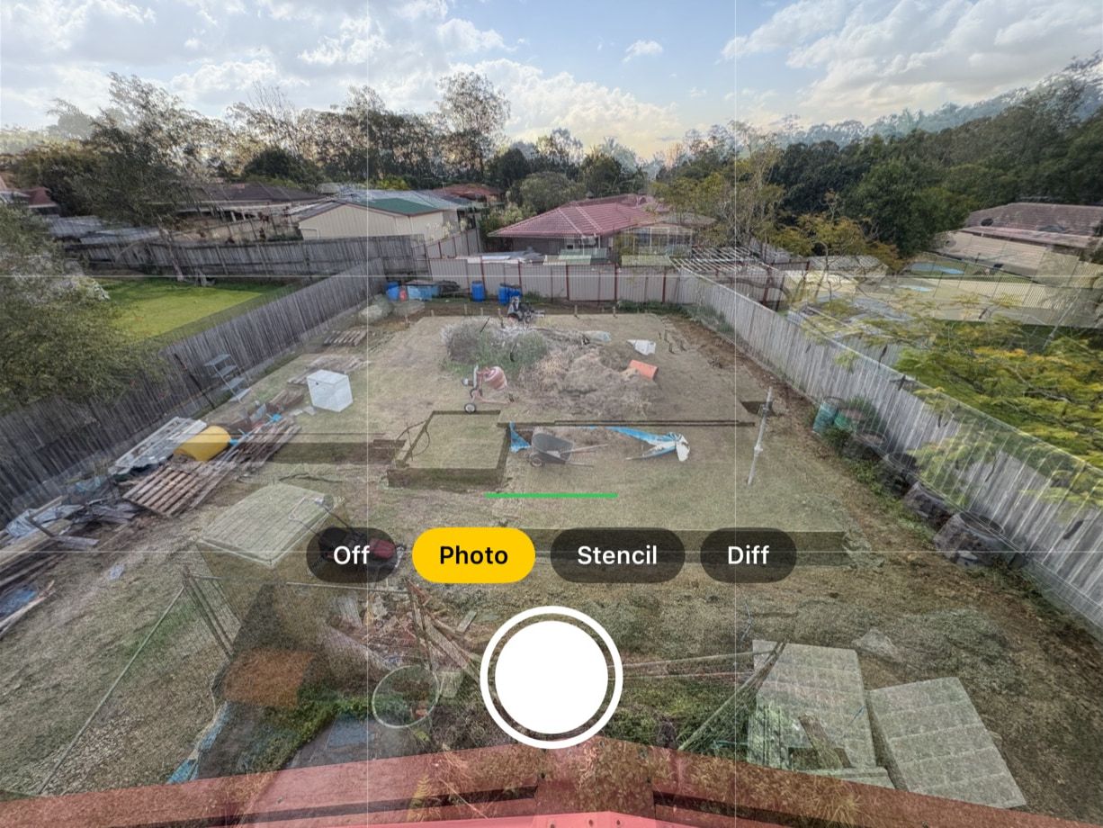 iPhone camera view: the 16 Aug backyard, with its mower, wheelbarrow and pallets, shows strongly over a concrete slab, with the Off, Photo, Stencil and Diff buttons and the shutter below.
