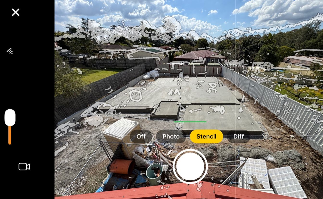 iPhone camera over a concrete slab, with Stencil selected among Off, Photo, Stencil and Diff, and the shutter below.